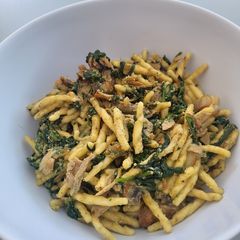 A picture of Trofie pasta with spinach, pesto and ricotta cheese.