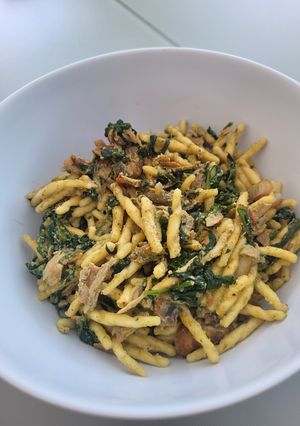 A picture of Trofie pasta with spinach, pesto and ricotta cheese.