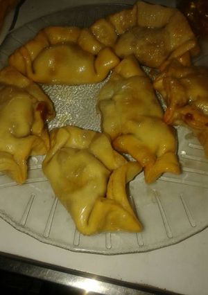 Una foto de Empanaditas de dulce de leche en almíbar