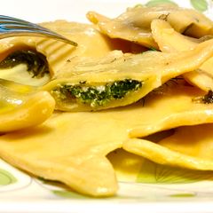 A picture of Spinach & Riccota Cheese Ravioli with Lemon Butter Sauce.