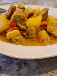 Una foto de Magro de cerdo al curry con zanahorias