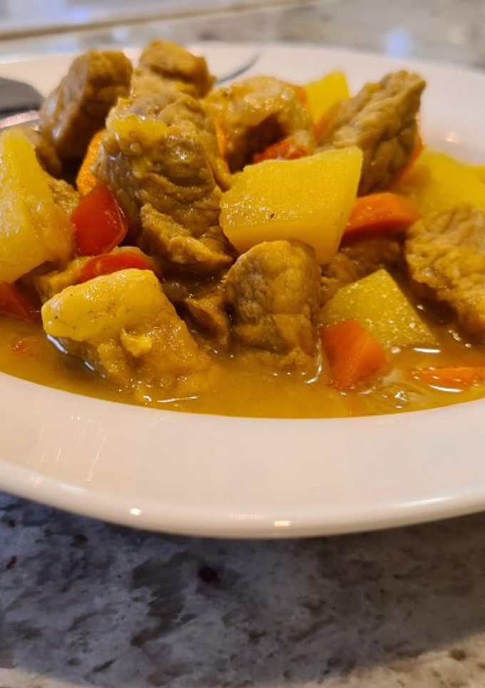Una foto de Magro de cerdo al curry con zanahorias