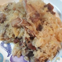 A picture of Sauerkraut and Crispy Porksteak.