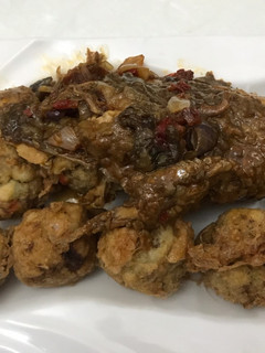 A picture of Yam balls with peppered fish.