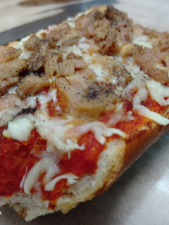 Una foto de Pizza con barra de pan