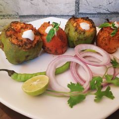 A picture of Tandoori stuffed capsicum & Tomato.