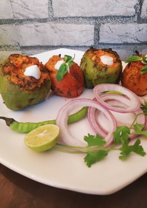 A picture of Tandoori stuffed capsicum & Tomato.
