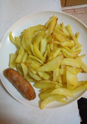 A picture of French fries and sausage #4weeks challenge.