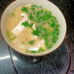 A picture of Fish& soya bean curd in soup.