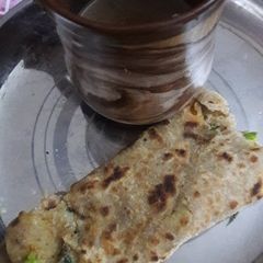 A picture of Aloo matar stuffed paratha.