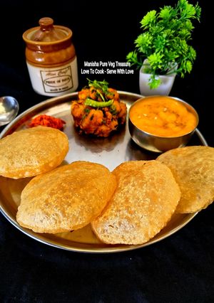 A picture of Aamras, Puri, Potato Dry Sabzi (Gujarati Mini Lunch Thali).