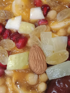 A picture of Colorful fruit and nuts chat.