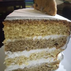 A picture of Coffee and orange cake.