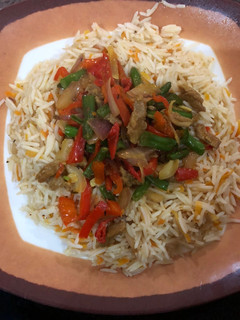 A picture of Carrot rice and shredded beef sauce.
