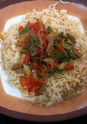 A picture of Carrot rice and shredded beef sauce.