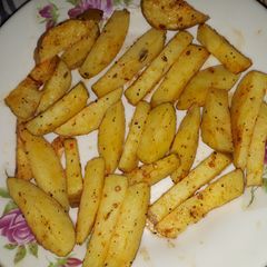 A picture of Spicy potato wedges.