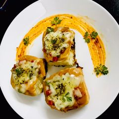 Stuffed Cheese veggie Pav Pizza A picture of Stuffed Cheese veggie Pav Pizza.