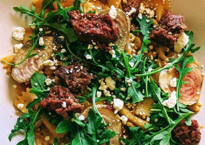 Farfalle with tomato pesto cream, beets, aragula, beyond meat