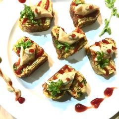 A picture of Heart shaped Korean rolled omlette canapé.