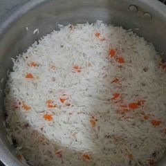 A picture of Rice  with carrots.
