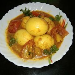 A picture of Tomato,Egg Curry.