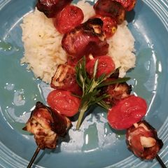 A picture of Prosciutto wrapped chicken kebabs.