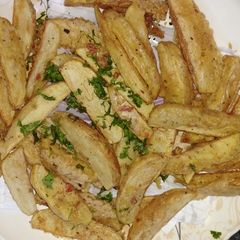 A picture of Potato wedges.