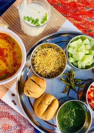 A picture of Mix grain baati and no onion garlic dal.