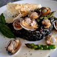 Risotto nero con vongole e telline con parmigiano e mela aioli