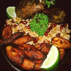 A picture of Mike's Jerk Chicken - Spicy Beans/Rice & Fried Plantains.