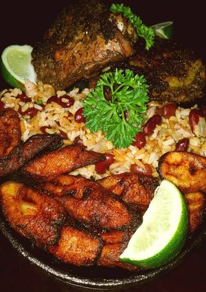 A picture of Mike's Jerk Chicken - Spicy Beans/Rice & Fried Plantains.