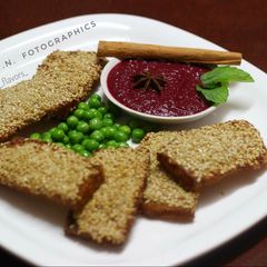 Sesame Chicken Toast with Beetroot-star anise dip A picture of Sesame Chicken Toast with Beetroot-star anise dip.