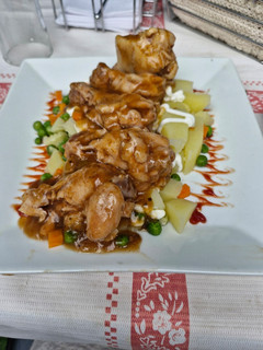 Una foto de Alitas Coreanas