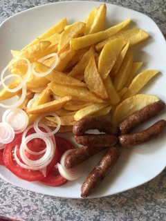 A picture of Chips and sausages for breakfast.