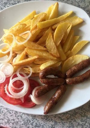 A picture of Chips and sausages for breakfast.
