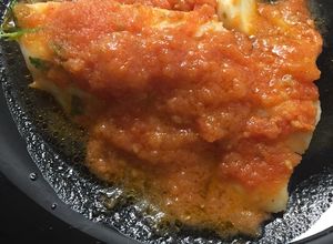 Una foto de Bacalao confitado con tomate frito