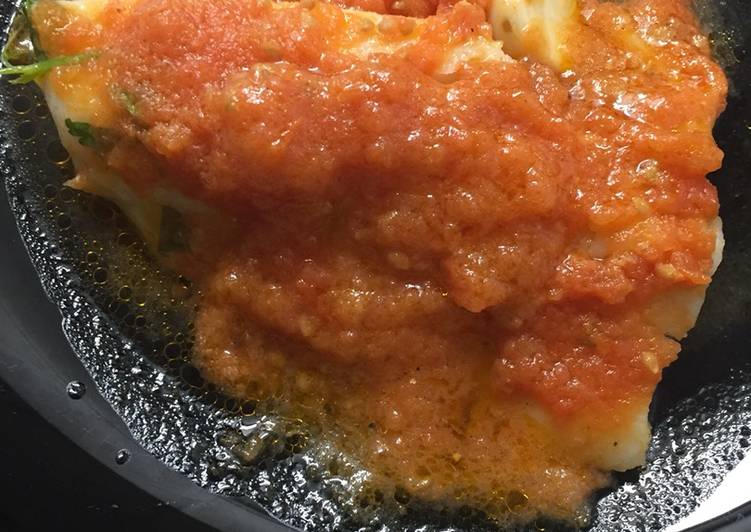 Bacalao confitado con tomate frito