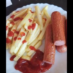 A picture of Fried potatoes and sausage.
