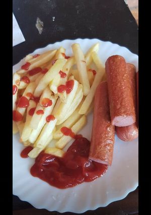 A picture of Fried potatoes and sausage.