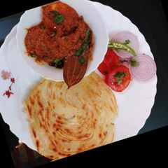 Kasmiri dum aalu with lachaa paratha A picture of Kasmiri dum aalu with lachaa paratha.