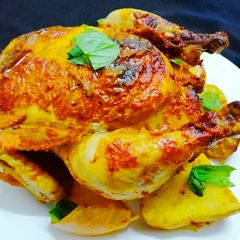 A picture of Masala roast whole Chicken.