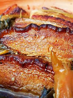 A picture of Braised Pork Belly with Dried Pickled Vegetables.