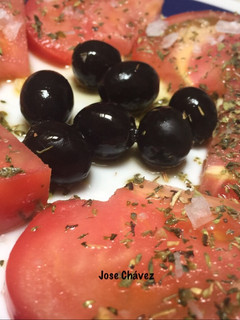Una foto de Tomates aliñados