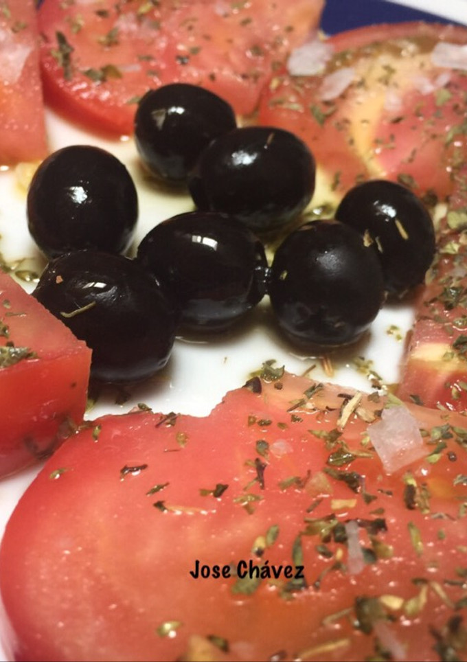 Una foto de Tomates aliñados