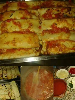 Una foto de Canelones de acelga con salsa roja
