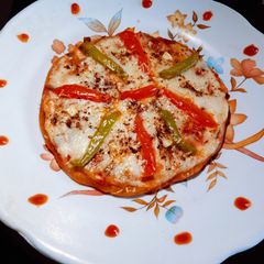 A picture of Healthy tasty homemade wheat flour Tawa pizza.