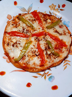 A picture of Healthy tasty homemade wheat flour Tawa pizza.