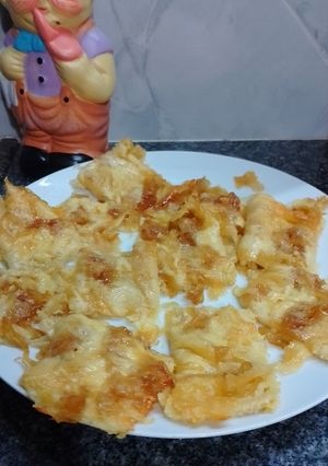 Una foto de Fainá con Cebolla Caramelizada y Queso dambo 🇺🇾