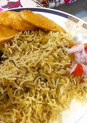 A picture of Channy ki daal waly rice with aaloo pakora.