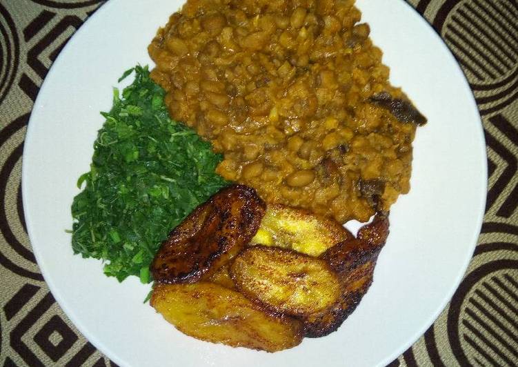 Porridge Beans With Fried Plantain and steamed Spinach